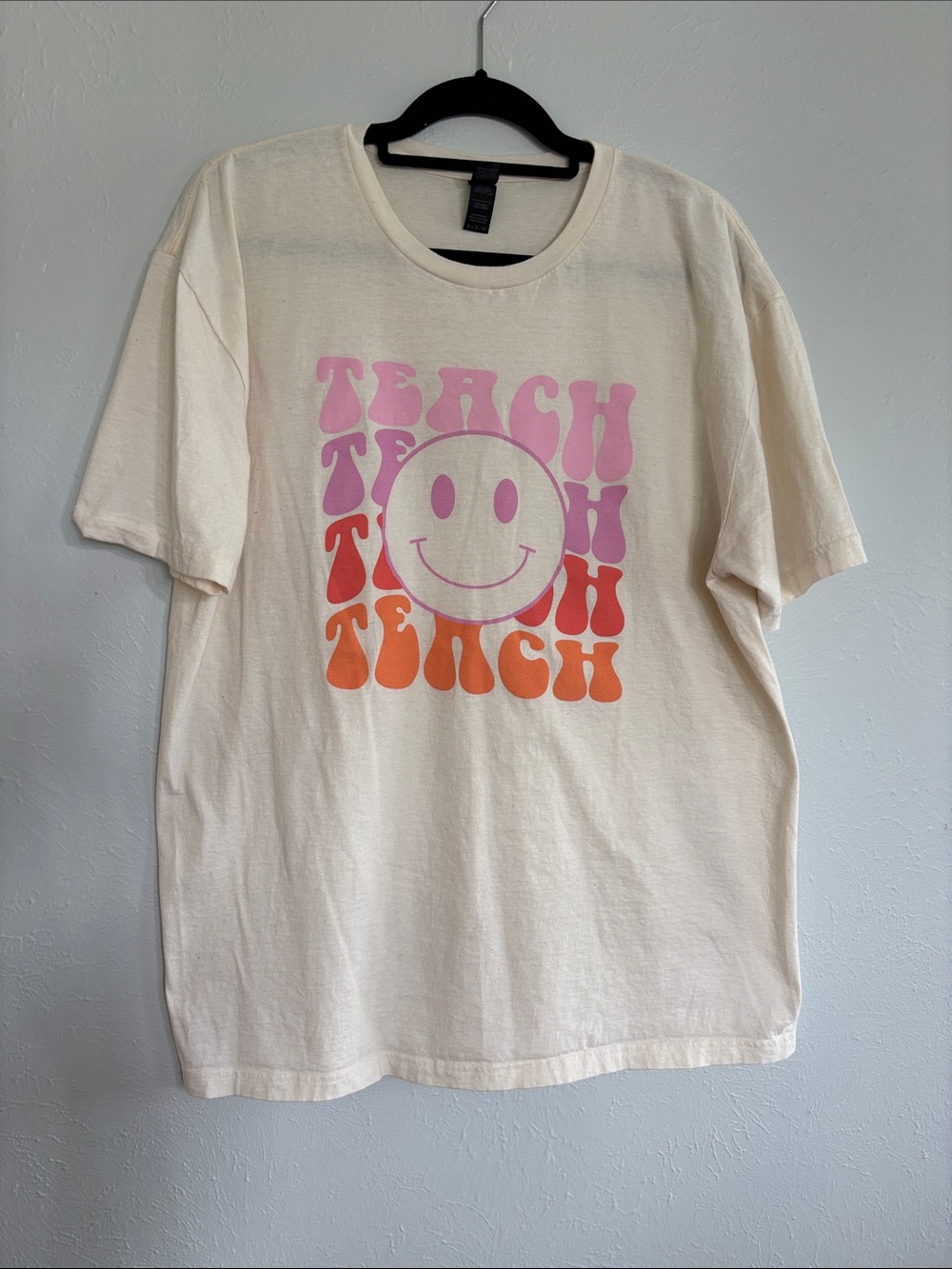 Gildan Cream Tee with Pink and Orange “Teach” Smiley Graphic